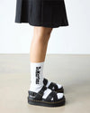 DR MARTENS VOSS II CROSS STRAP SANDAL.